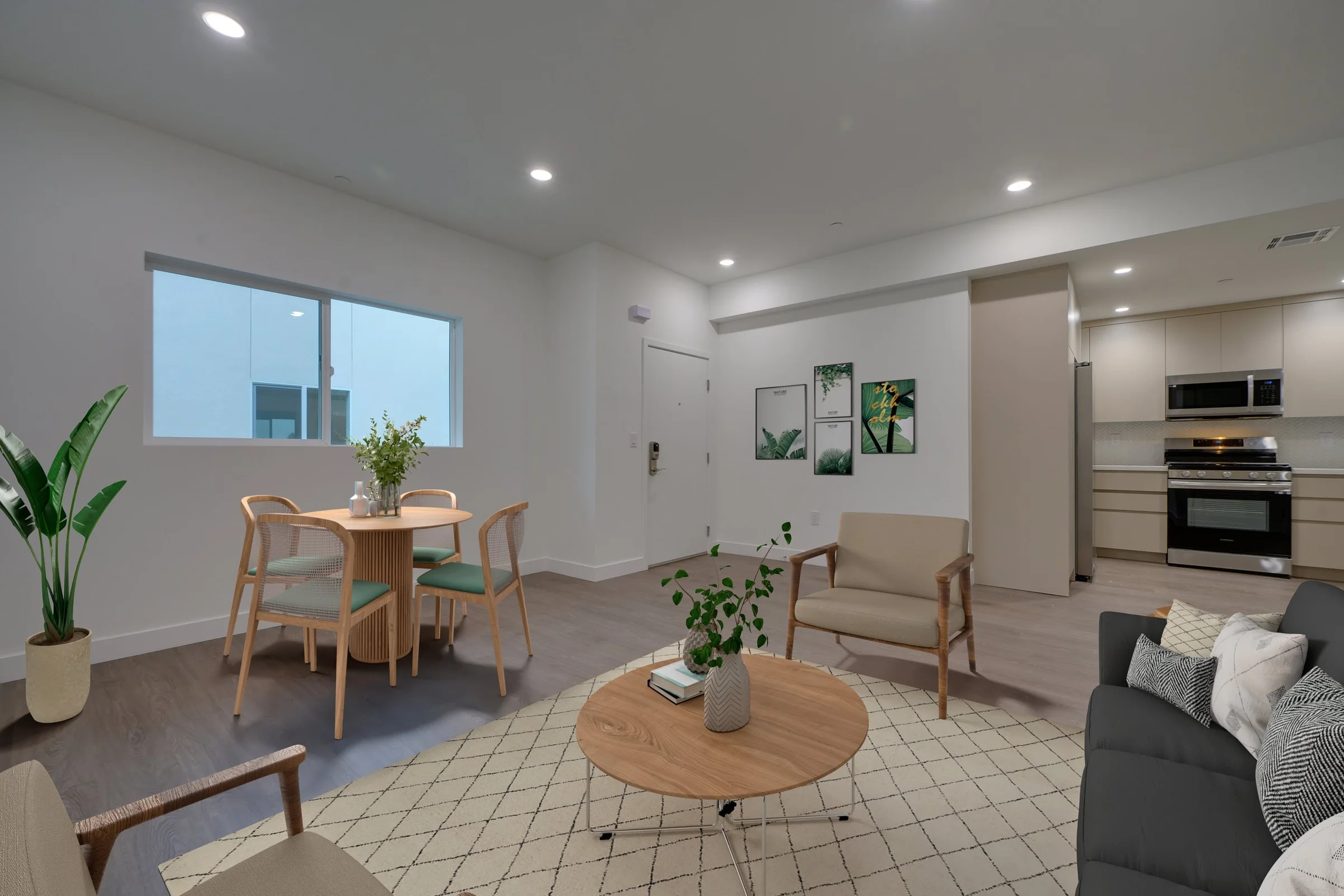 Pine on Gramercy dining and living room with city-facing windows