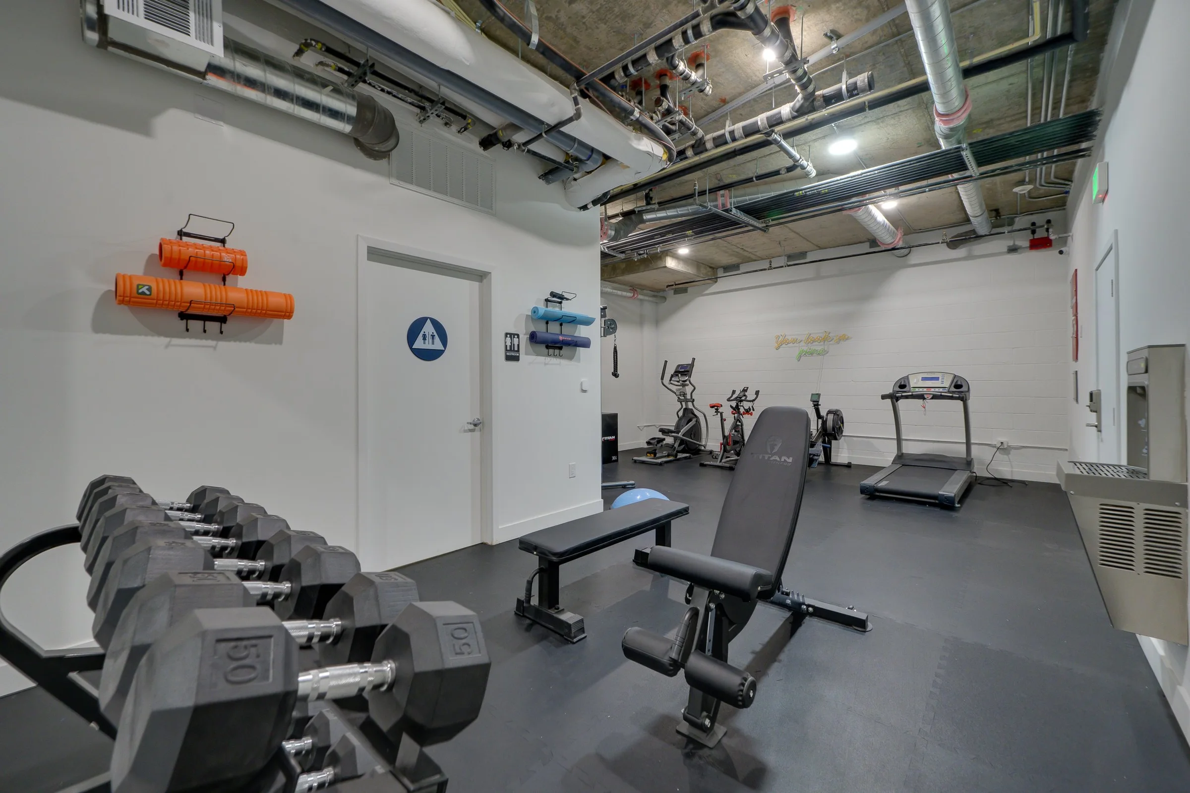Pine on Gramercy fitness center with free weights and cardio equipment